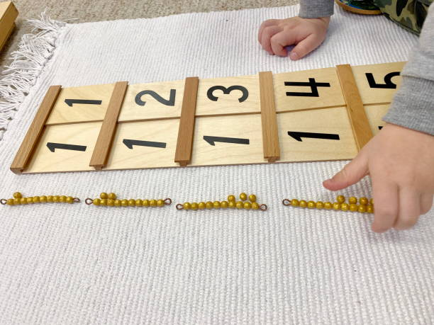 Child exploring Montessori number rods and bead materials