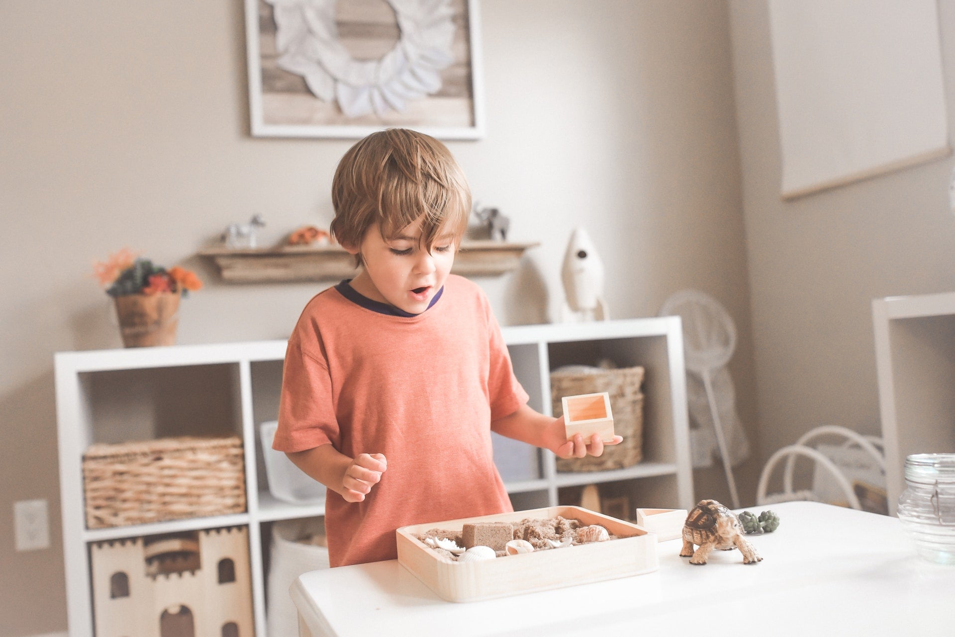 Montessori wooden toys for 4-year-olds including peg dolls, puzzles, and building sets from Oliver and Company