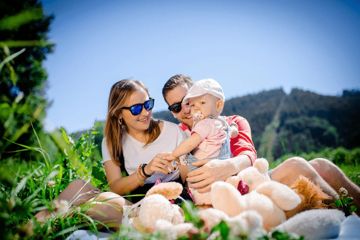 Montessori wooden baby toys including rattles, teethers, and sensory toys from Oliver and Company