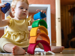 a child playing with arch stacking blocks Montessori Toys