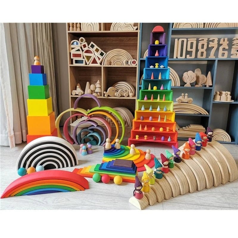 A collection of eco-friendly wooden toys, including a rainbow-shaped object and stacked toys, displayed on a shelf, embodying educational Montessori principles.