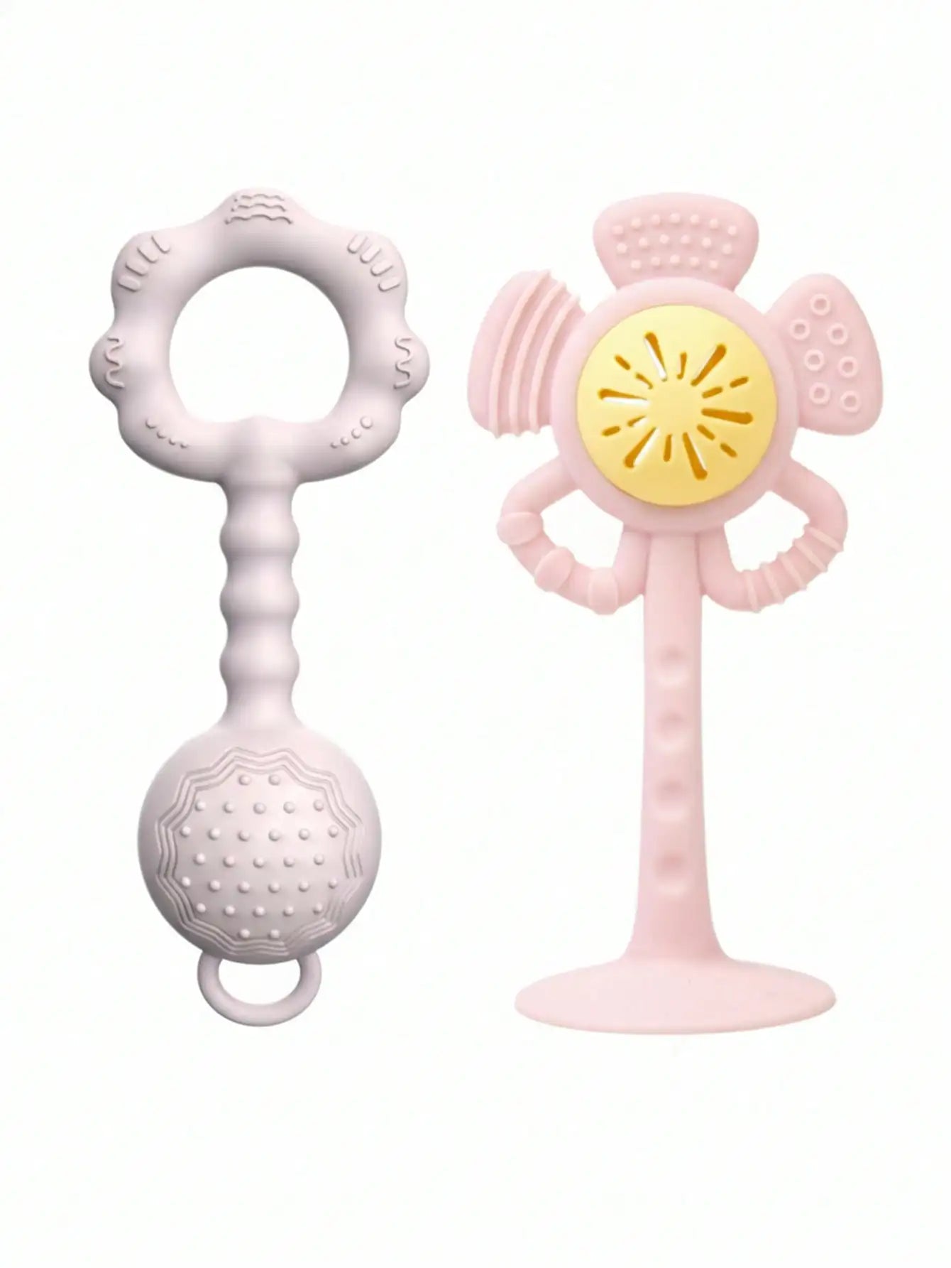 Two baby teething toys on a plain white background: a pale pink textured ring teether on the left and a pale pink flower-shaped wiggly wobble toy with a yellow center on the right.