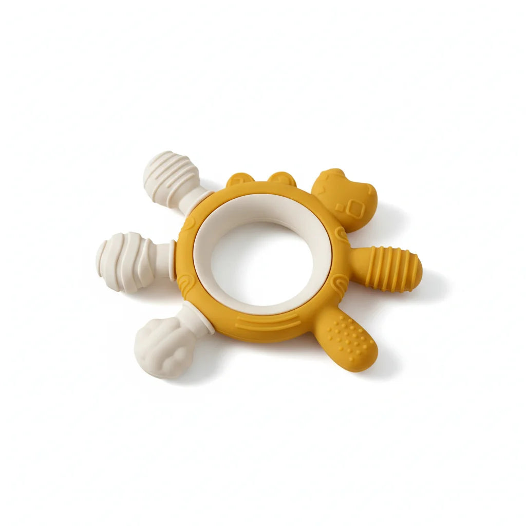A baby teething toy shaped like a lion, featuring a mustard yellow body with textured paw and cheek paws, and four off-white silicone sensory arms, shown on a clean white background.