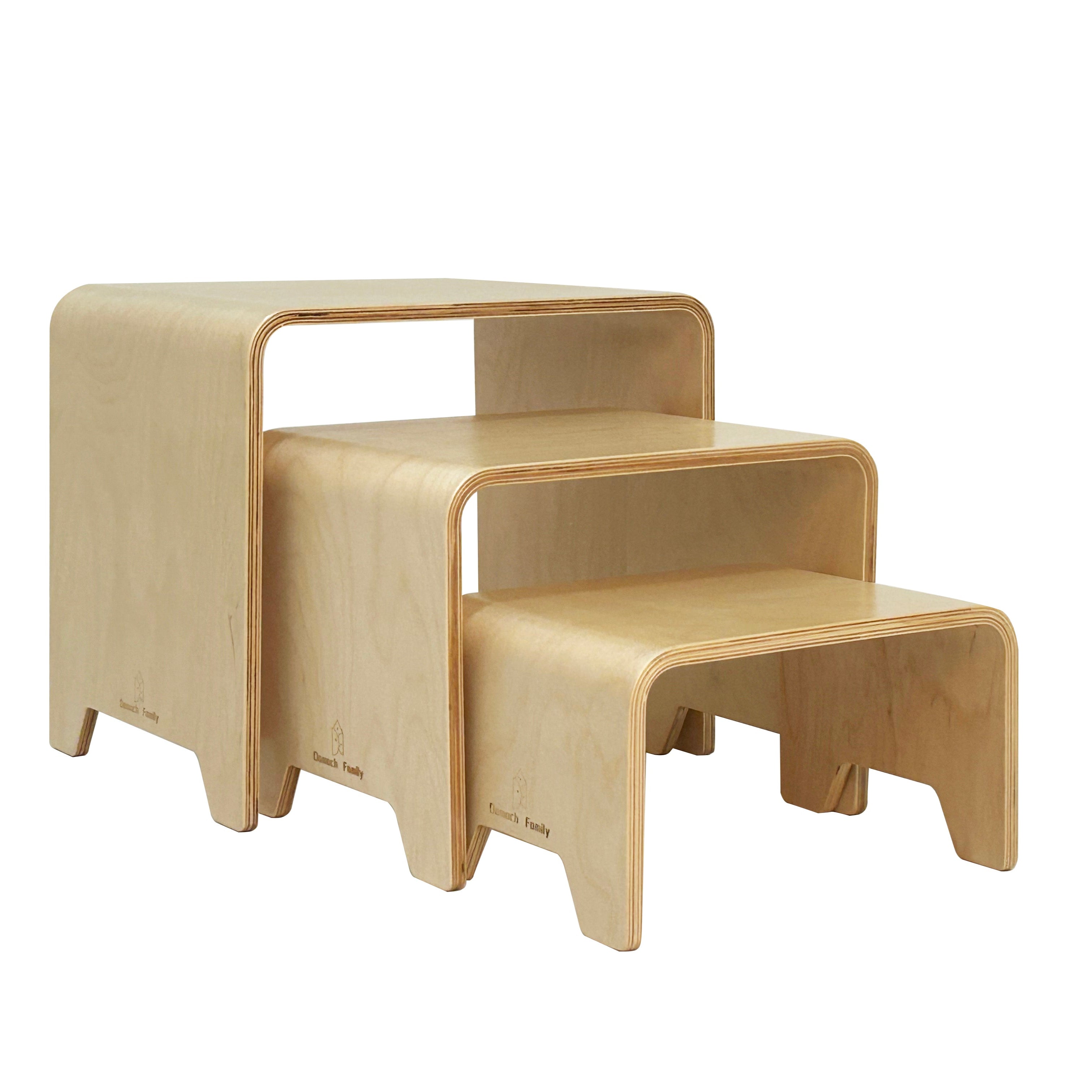 Set of three wooden nesting tables on a white background