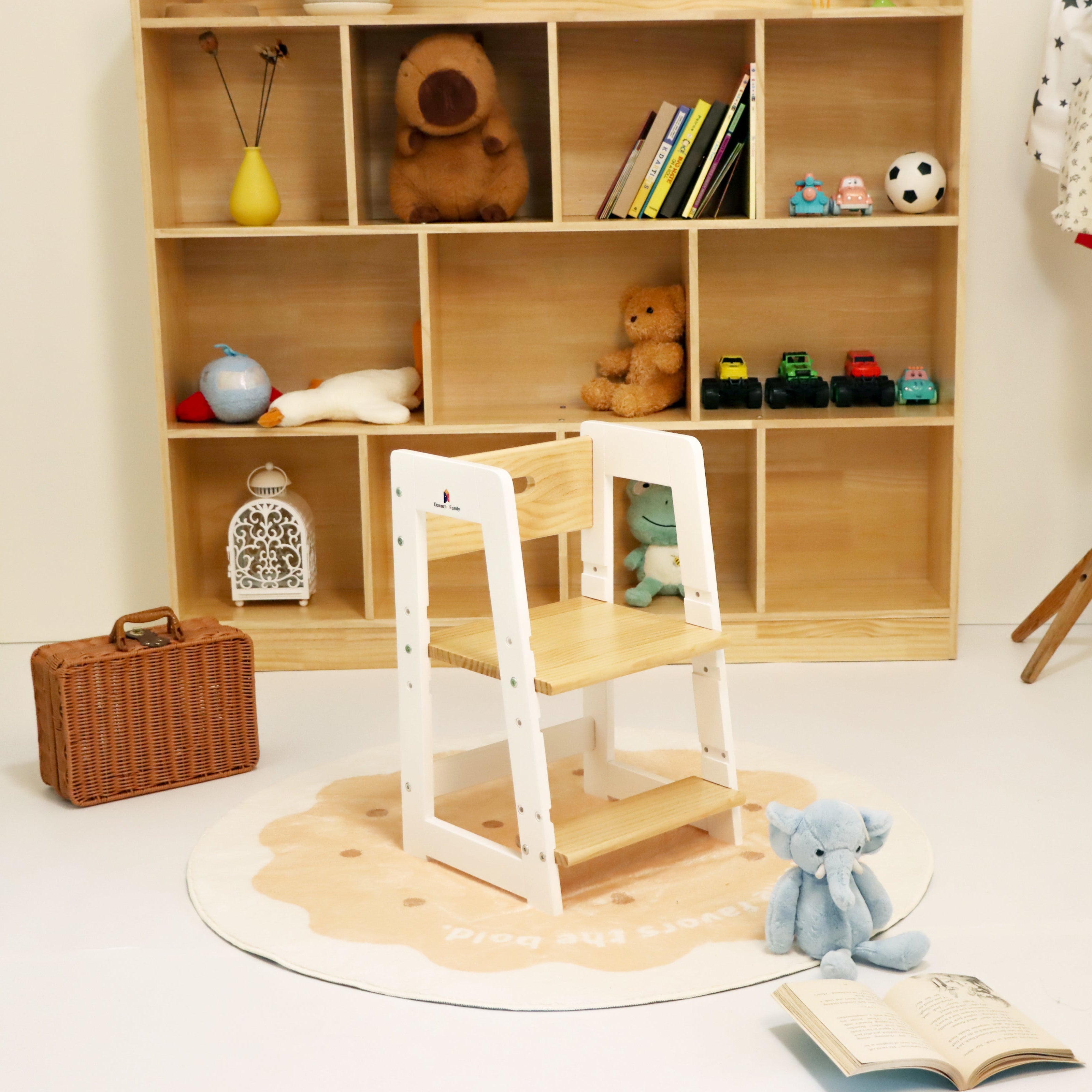 Children's room with wooden shelf, chair, and toys on a white floor.