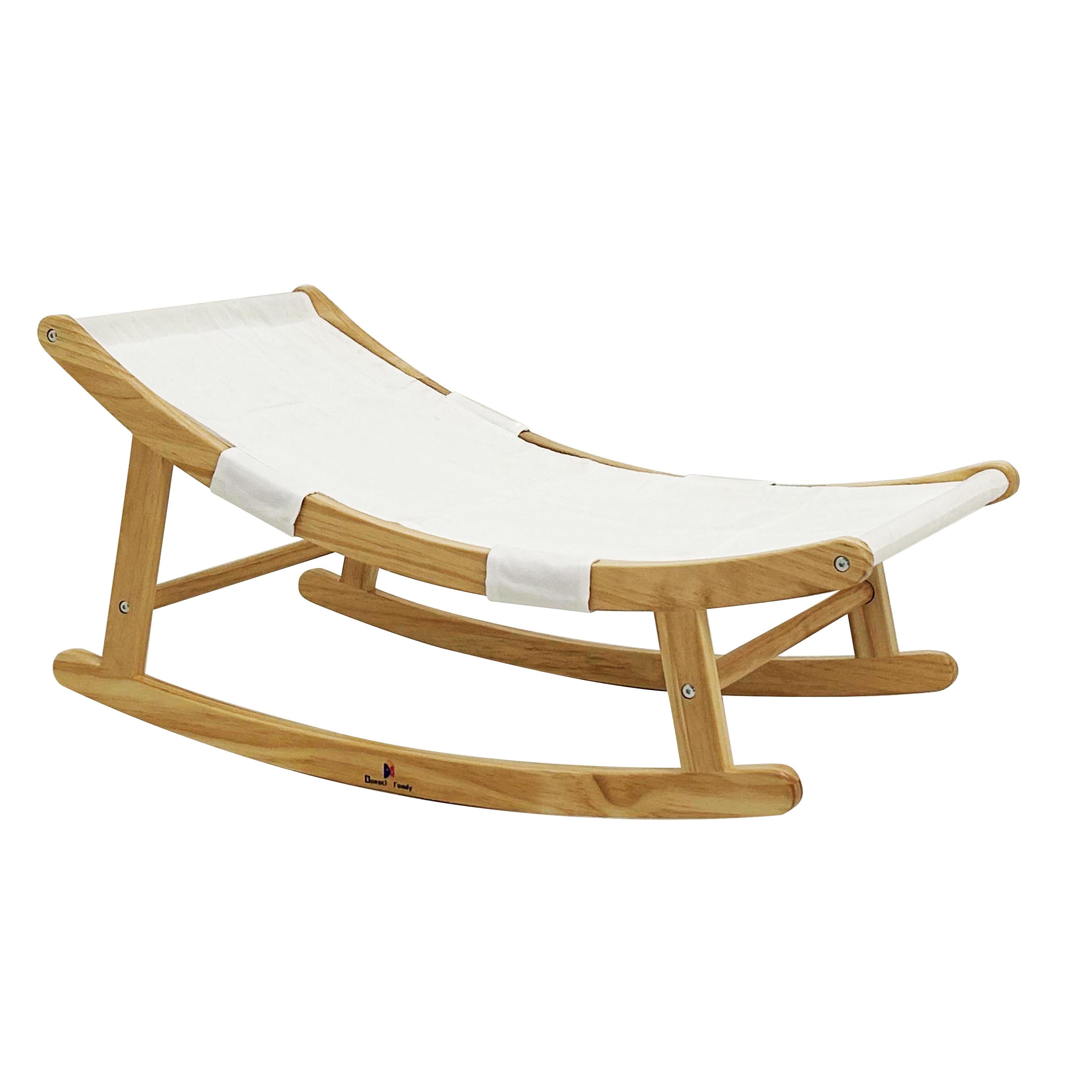 Wooden rocking chair with white cushion on a white background