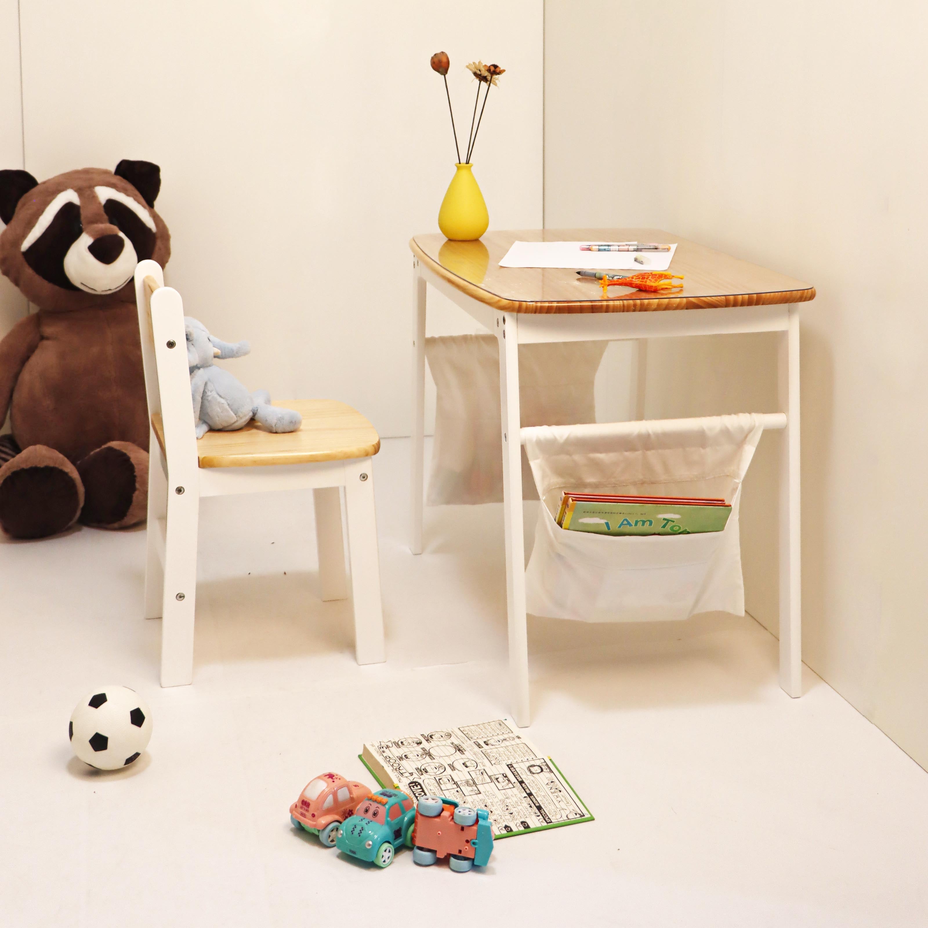 Children's playroom with a small desk, chair, and toys on a light-colored floor.