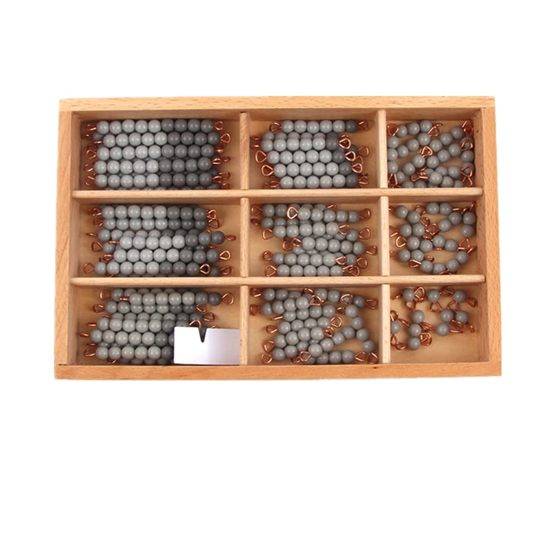 Gray Montessori bead bars sorted in a wooden box