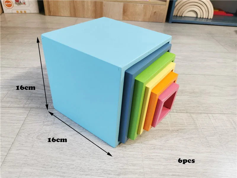 Set of colorful foam blocks with dimensions on a wooden floor