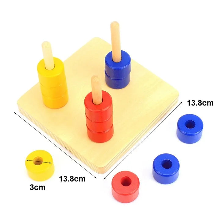 Three colored dowels on a 13.8cm base with 3cm discs