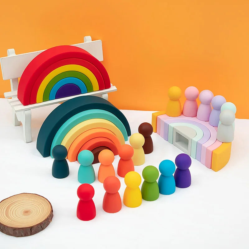 Colorful wooden toy set including a rainbow, bench, and various figures on an orange background