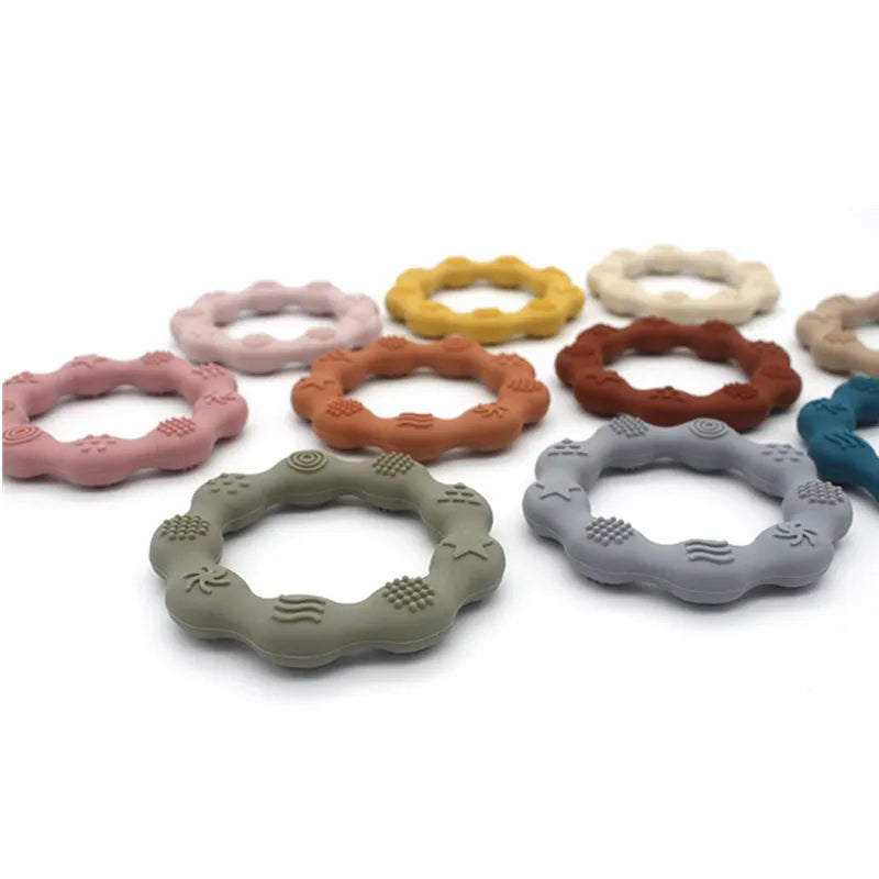 Wavy silicone teething rings laid out in many colors