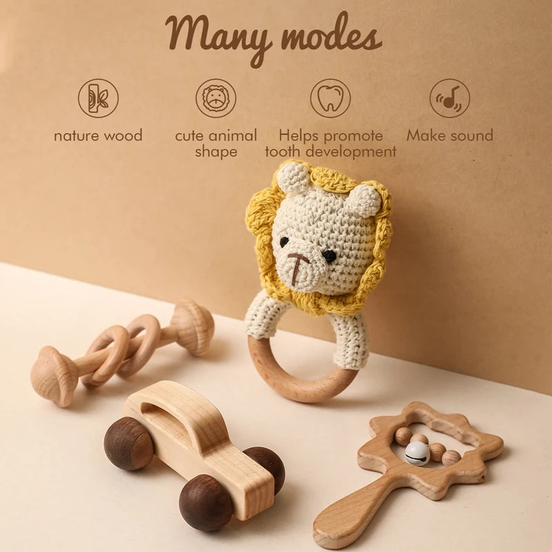 Set of wooden toys including a lion-shaped teething ring on a beige background.