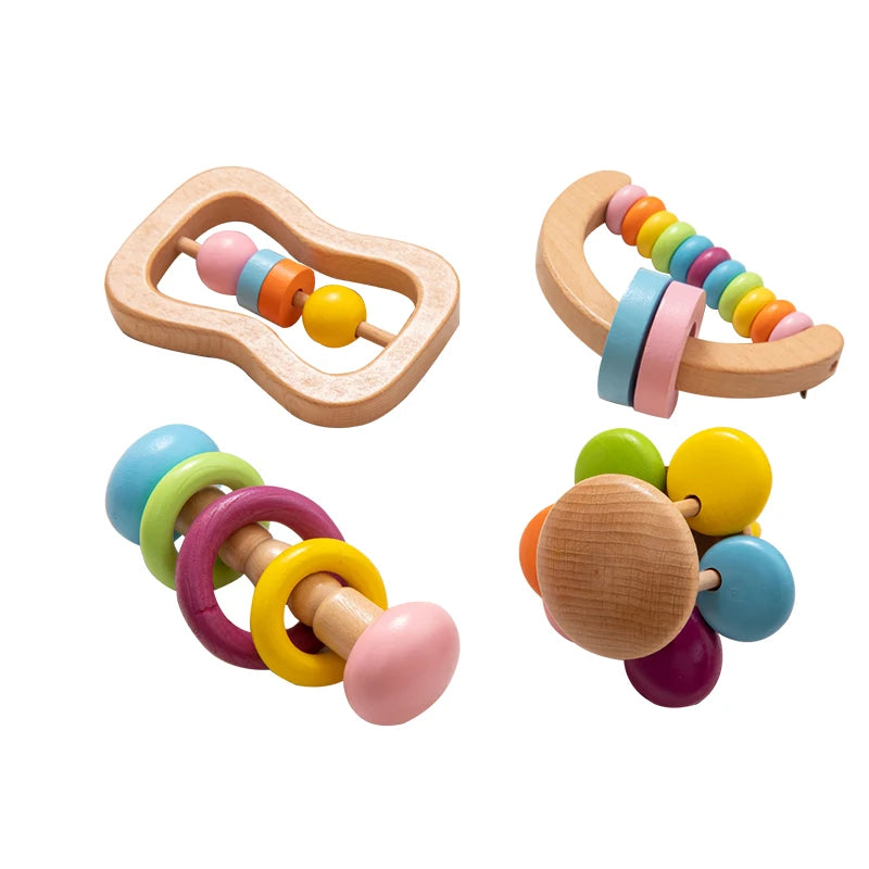 Set of colorful wooden baby teething rings on a white background