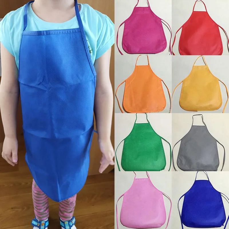 Kids Terylene Apron for Painting, Cooking, Baking, and Crafting, shown worn by a child, showcases durable design suitable for ages 3-6.