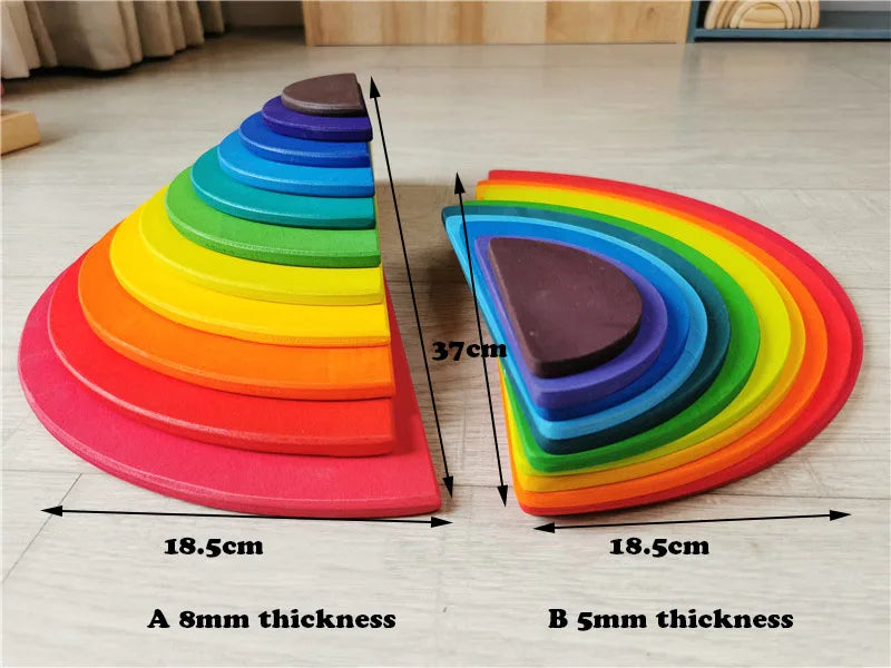 Colorful wooden stacking semi-circles with measurements on a light wood floor.
