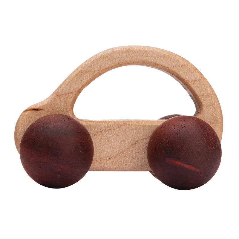 Wooden baby rattle with two brown spheres and a wooden handle on a white background