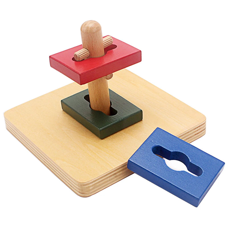 Red rectangle being twisted onto the pegged dowel