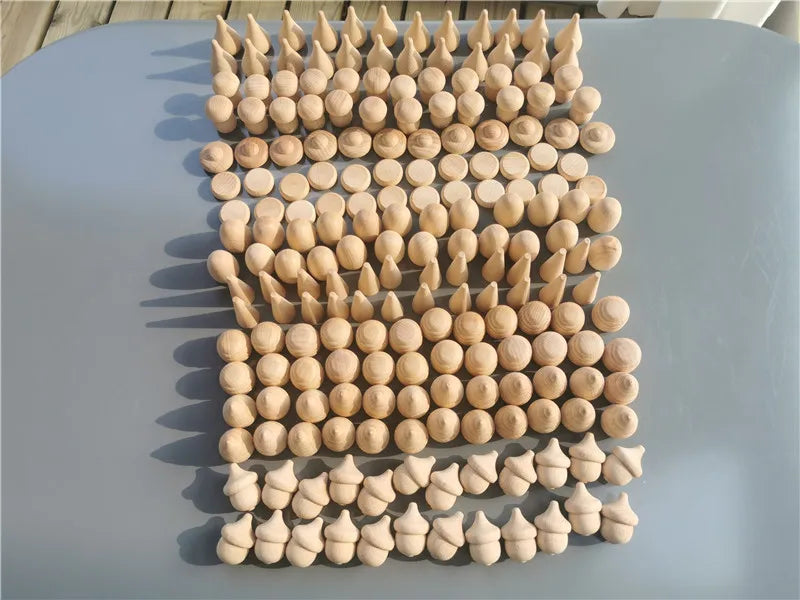 Wooden pegs arranged in a grid pattern on a light blue surface