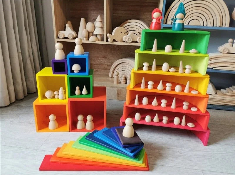 Colorful wooden toy set with shelves and figurines on a wooden floor.