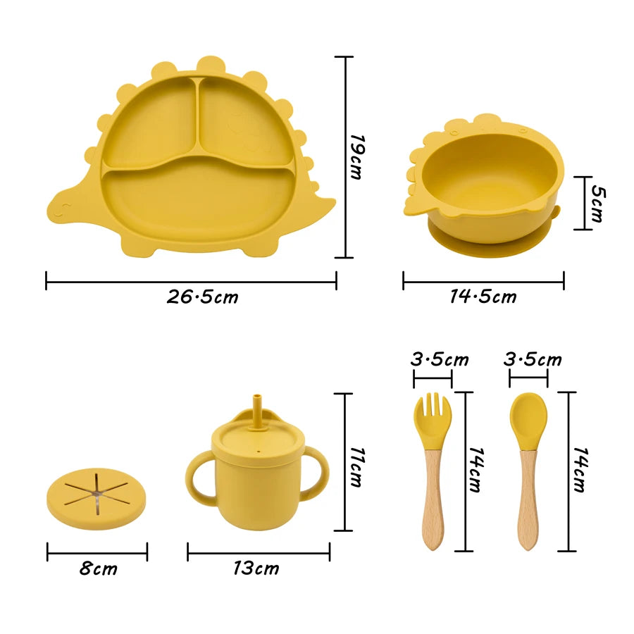 Yellow children's tableware set with measurements on a white background