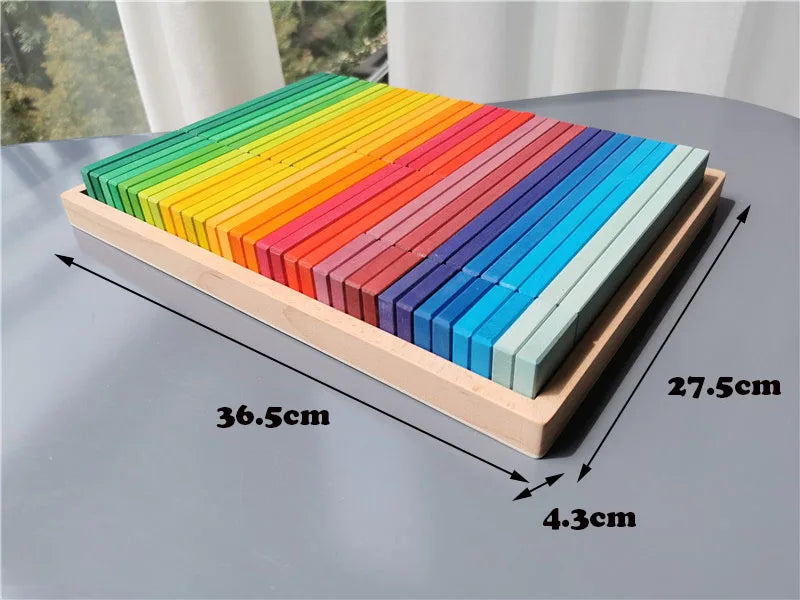 Set of colorful wooden blocks on a gray surface with measurements indicated.