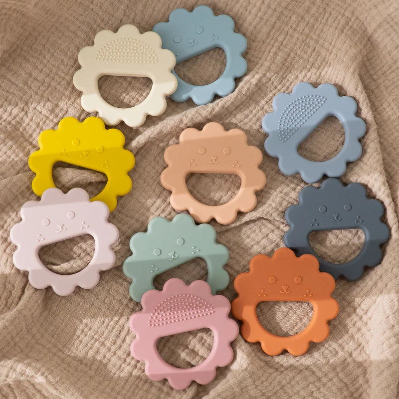 Sunflower face silicone teethers in many soft colors