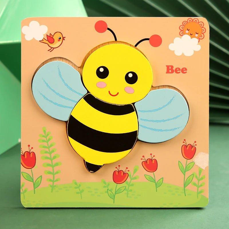 Wooden bee puzzle with colorful wings on a green background