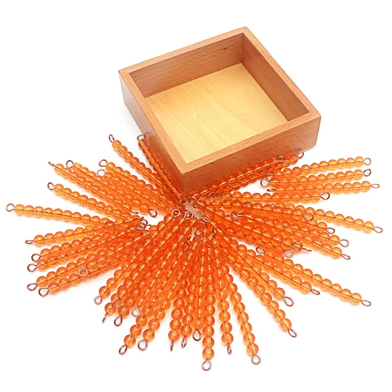 45 golden ten bars spread around a wooden box