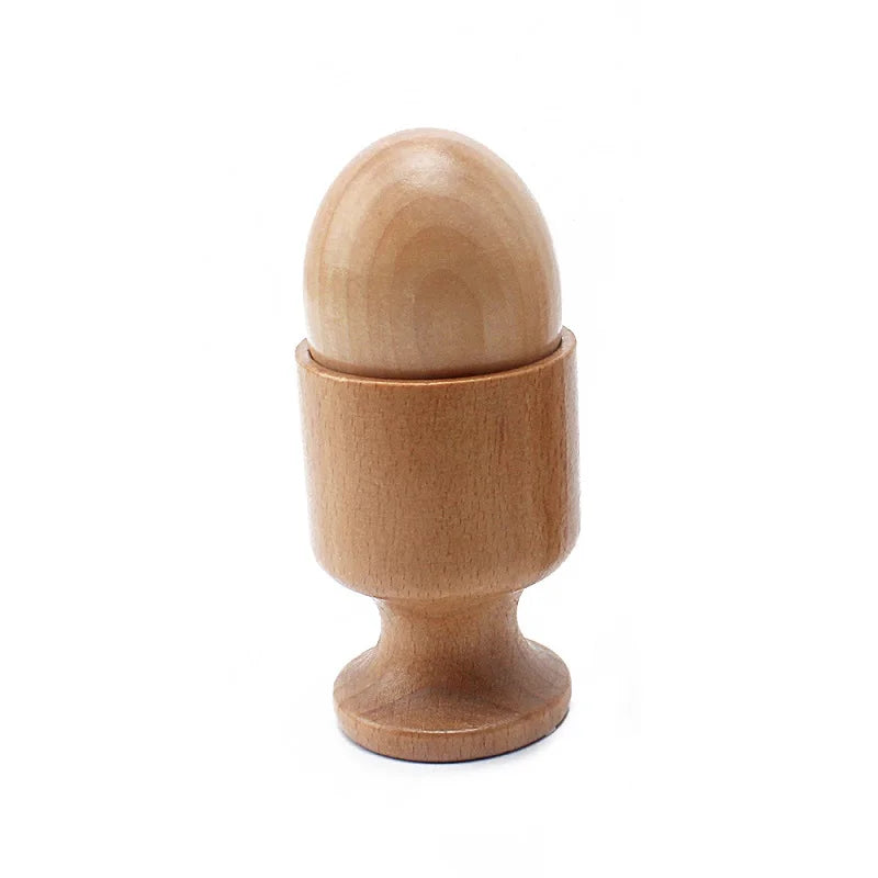 Wooden egg in an egg cup