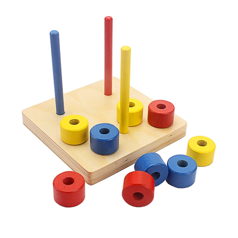 Three colored dowels with discs spread around the base