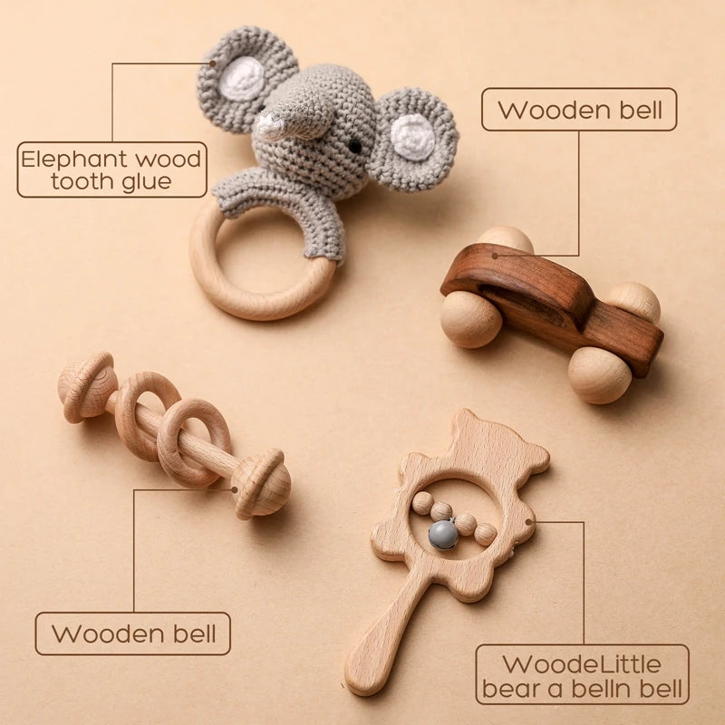 Set of wooden toys including a mouse-shaped rattle, car, and other items on a beige background.