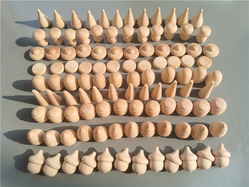 Collection of wooden spikes and cones arranged in rows on a gray surface