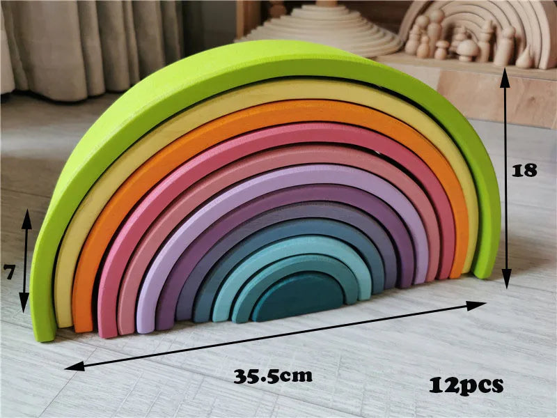 Colorful wooden rainbow toy with measurements on a light surface