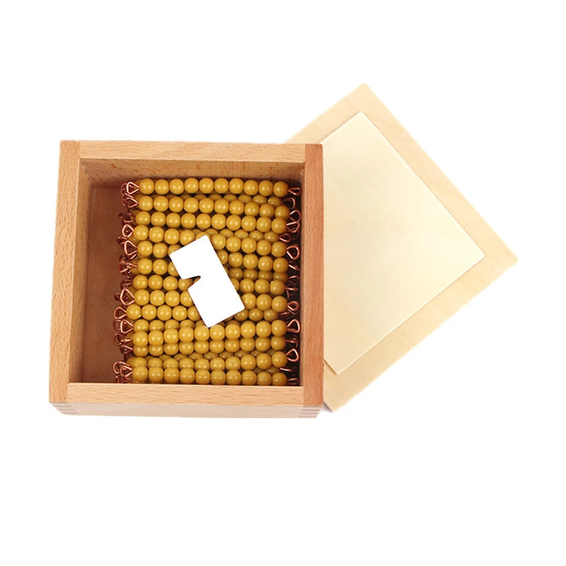 Golden bead bars in a wooden box with a sliding lid