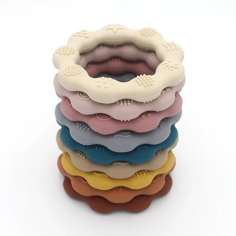 Wavy silicone teething rings stacked in a tower