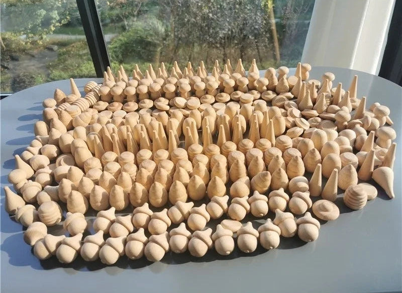 Collection of wooden pieces arranged in a pattern on a flat surface.