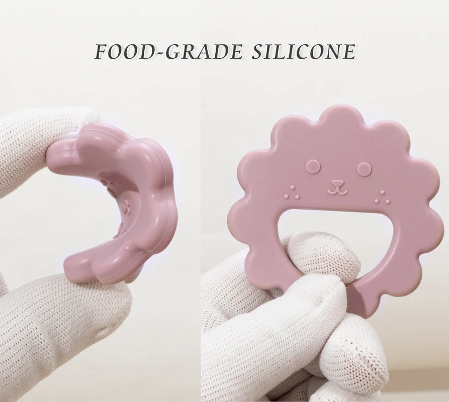 Hands bending a soft, food grade silicone sunflower teether