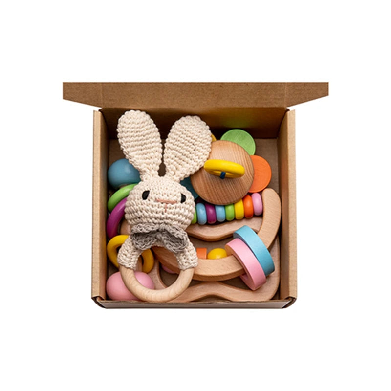 Wooden Baby Rattle Gift Set featuring educational and musical wooden toys, ideal for sensory development and creativity in infants, from Oliver & Company Montessori Toys.