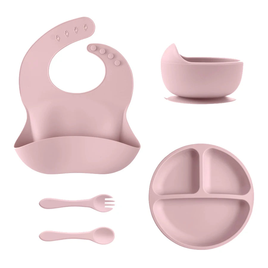 Light pink bib, divided plate, bowl, spoon and fork