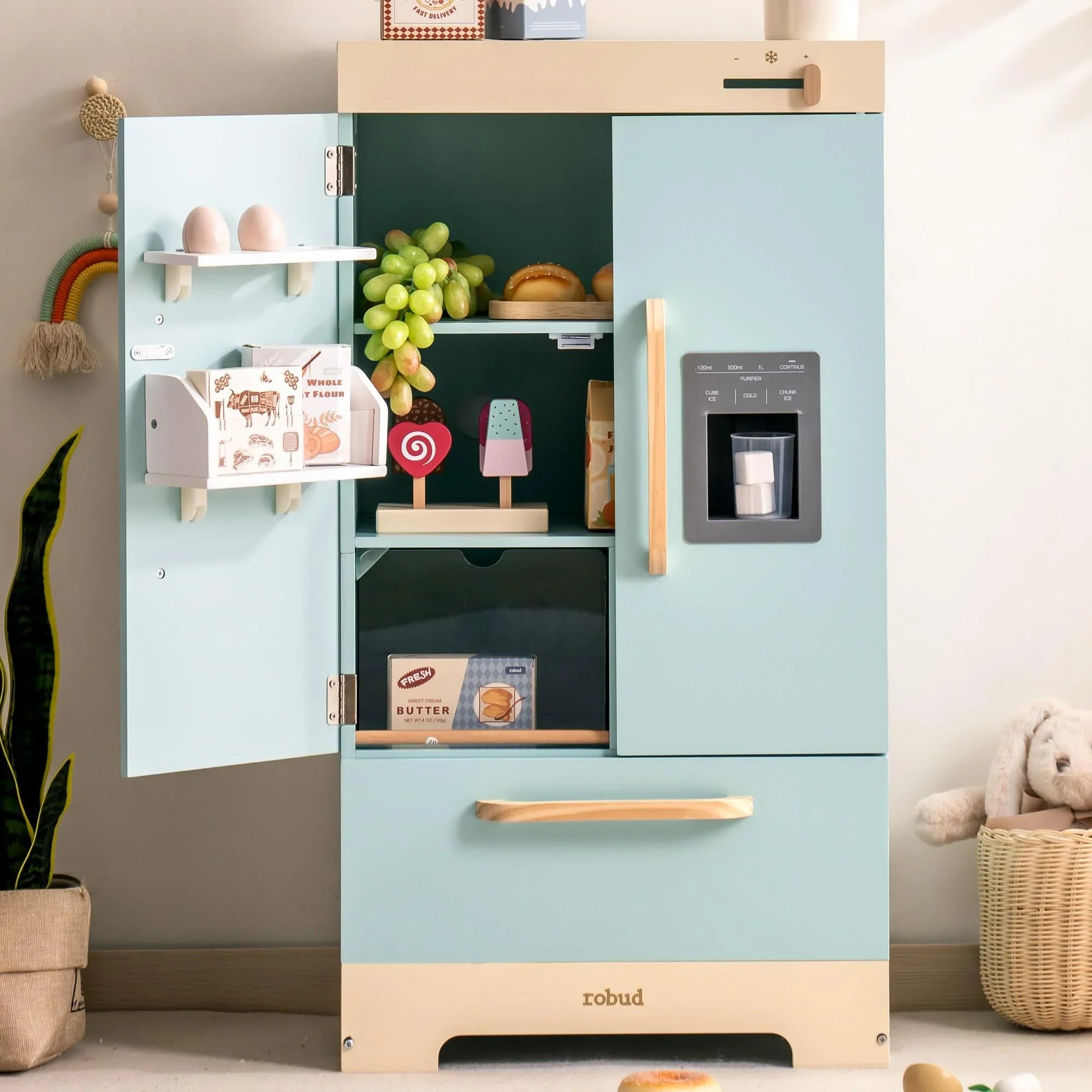 Children's toy kitchen set with a refrigerator and shelves in a room setting.