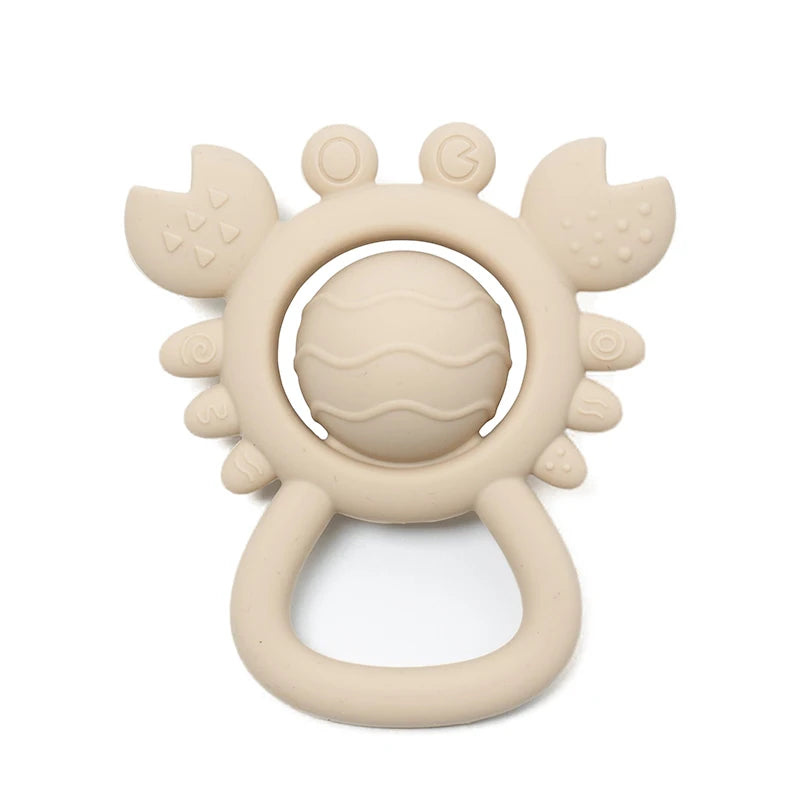 Beige teething ring with sun design on a white background
