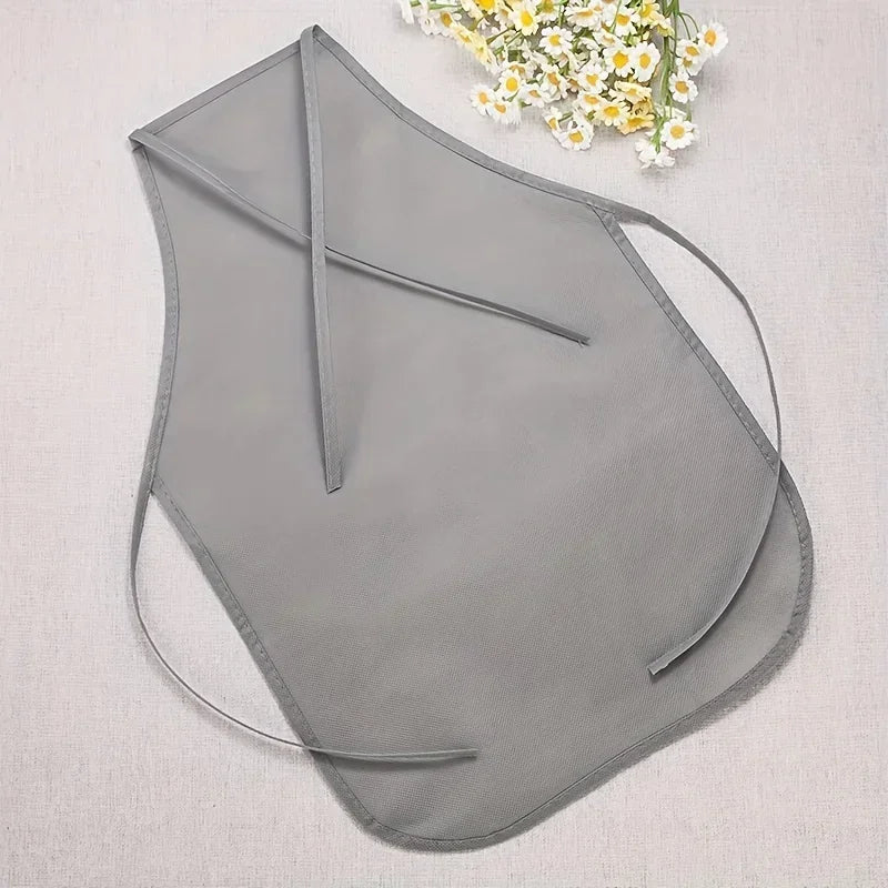 Gray swimsuit top on a light gray background with white flowers.