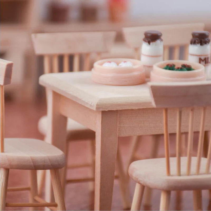 Wooden dining table with chairs and decorative items in a blurred indoor setting