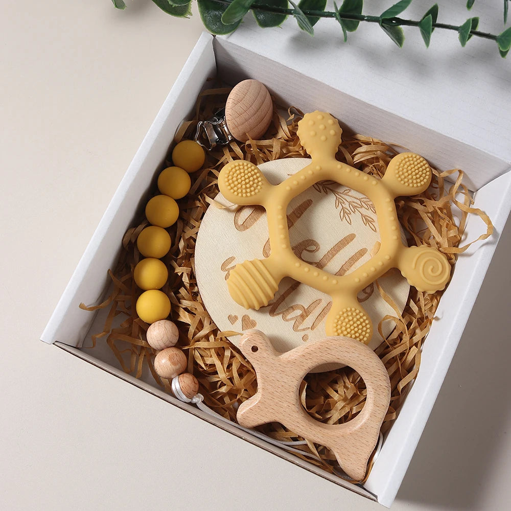 Teething toys in a decorative box with natural elements