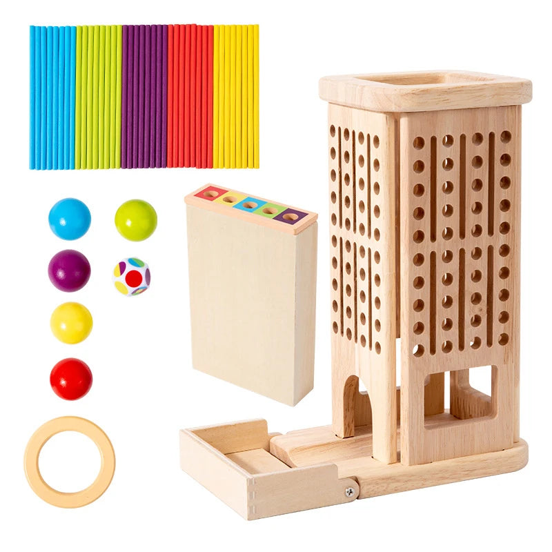 Montessori-inspired wooden stick tower game with colorful sticks, a matching dice, and a color matching box, displayed on a wooden table.