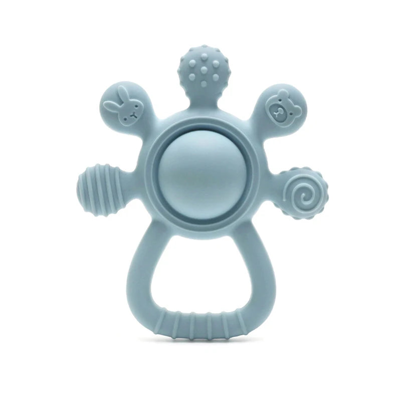 Light blue baby teething ring with various textures on a white background