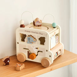 Montessori Activity Cube: Wooden busy bus toy with 8 games. Perfect for babies and toddlers 0-18 months. Durable, educational, and available in 2 color options