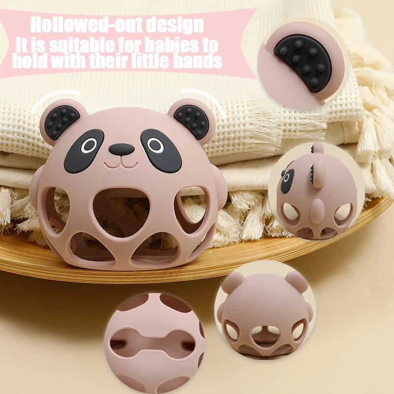 Panda-shaped silicone teether on a wooden tray with text about its suitability for babies.