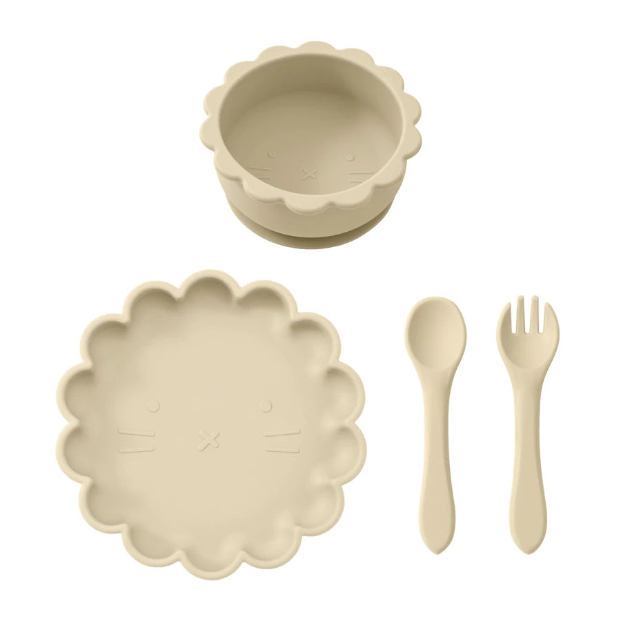 Beige ceramic tableware set with bowl, plate, spoon, and fork on a white background